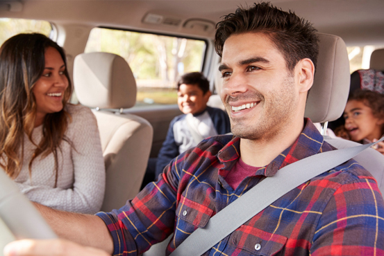 Happy family on an outing in the car