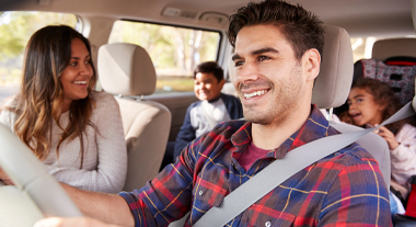 Happy family on an outing in car