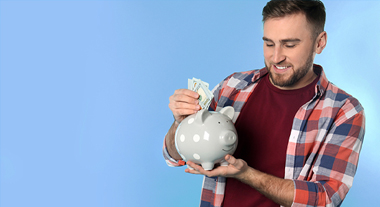 Putting cash into piggy bank
