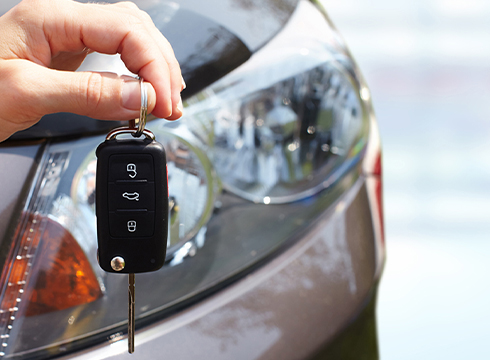 Holding keys to new car