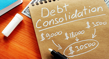 Notebook showing debt consolidation calculations