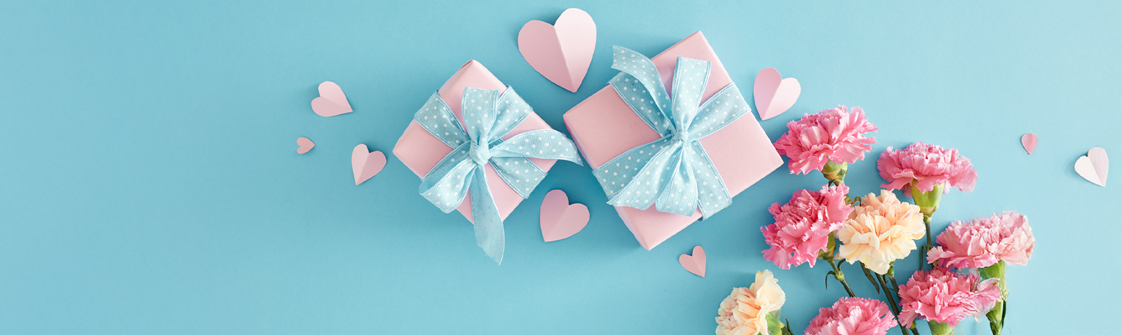 Hands holding gift box with confetti