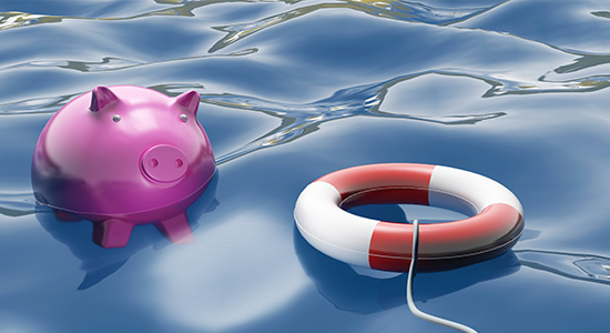 Piggy bank floating in ocean towards a lifesaver