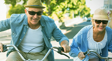 Retired couple riding bikes