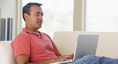 Person using laptop at home