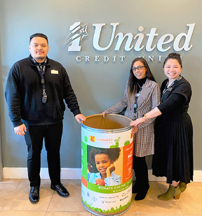 Staff setting up food barrel at our branch