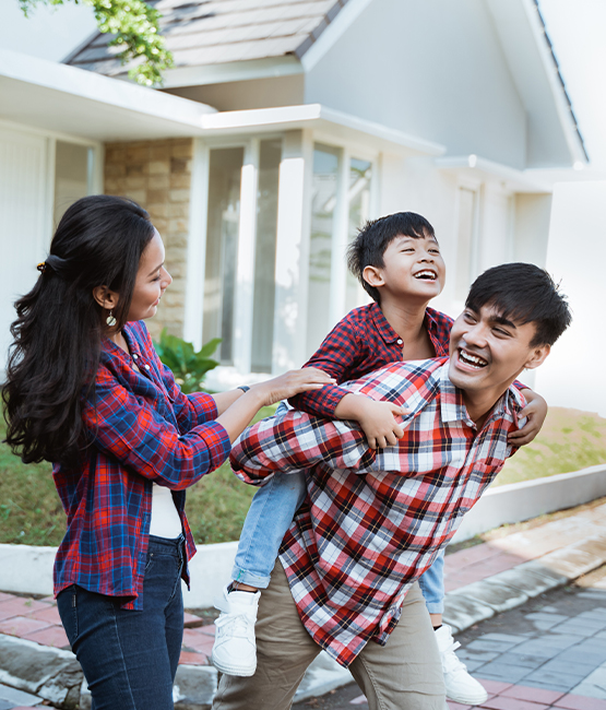 Family playing in front yard