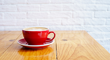 Coffee cup and saucer on table